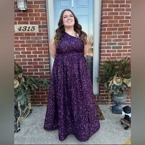 Purple one shoulder prom dress.